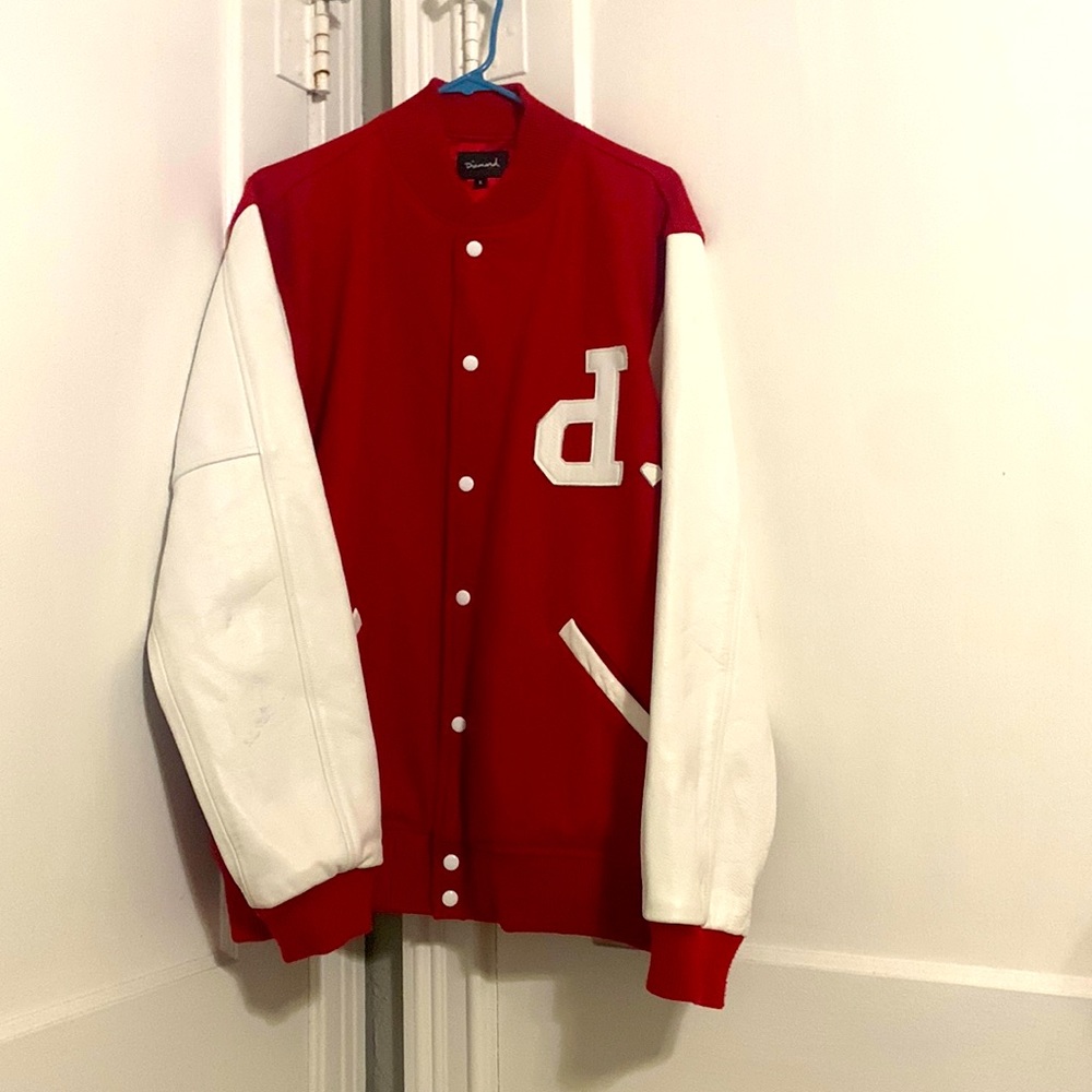 Diamond supply varsity jacket with genuine leather sleeves.